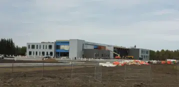 A building that is under construction with a fence around it.