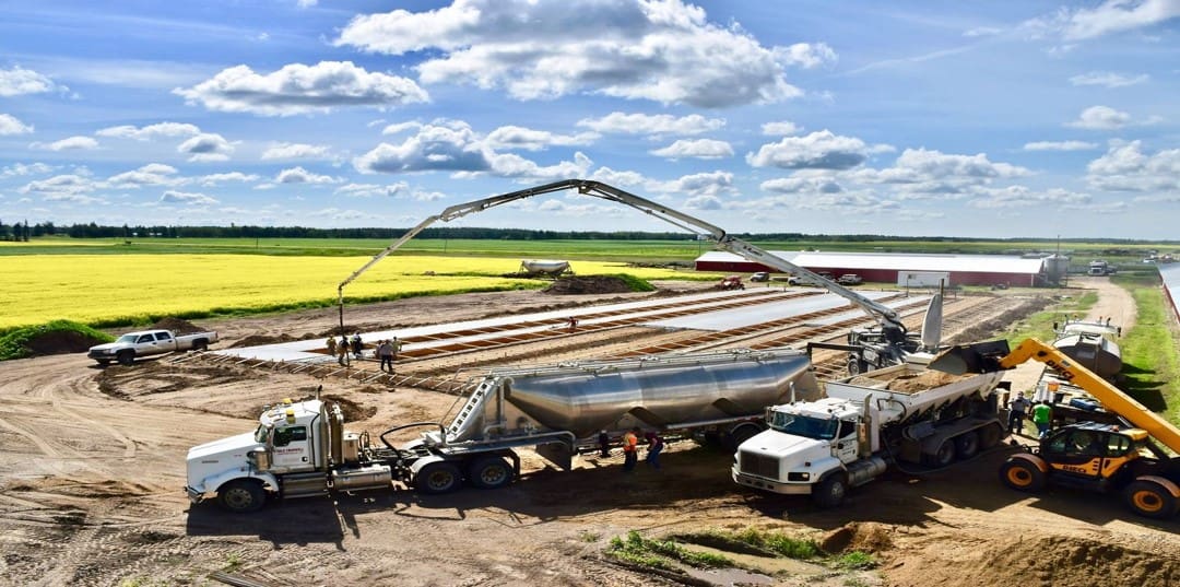 A couple of trucks are parked on the ground